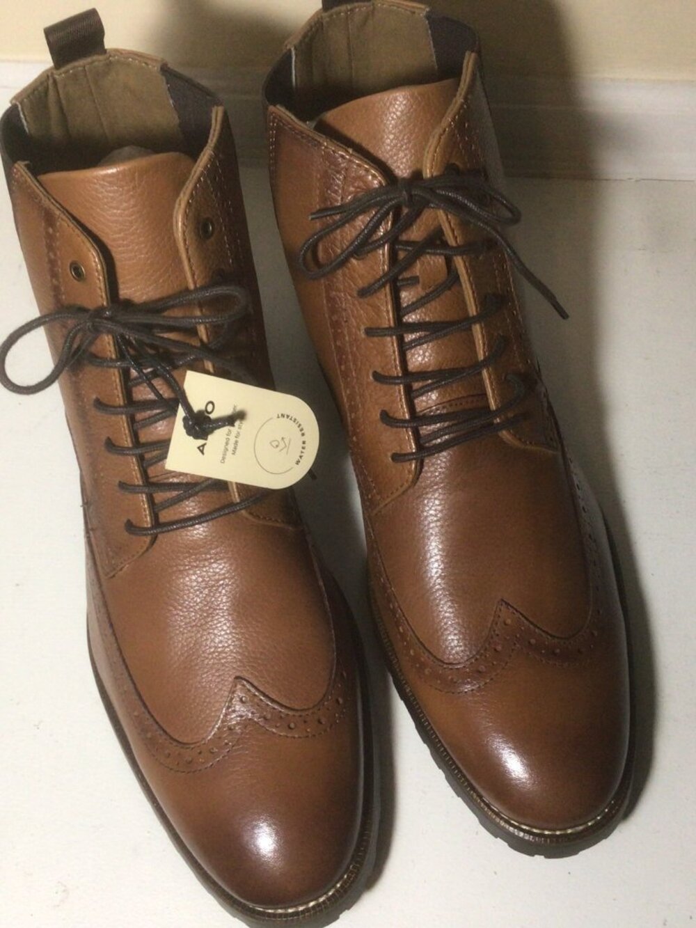 Tan leather wing tip ankle boots from Aldo new unworn with tags.